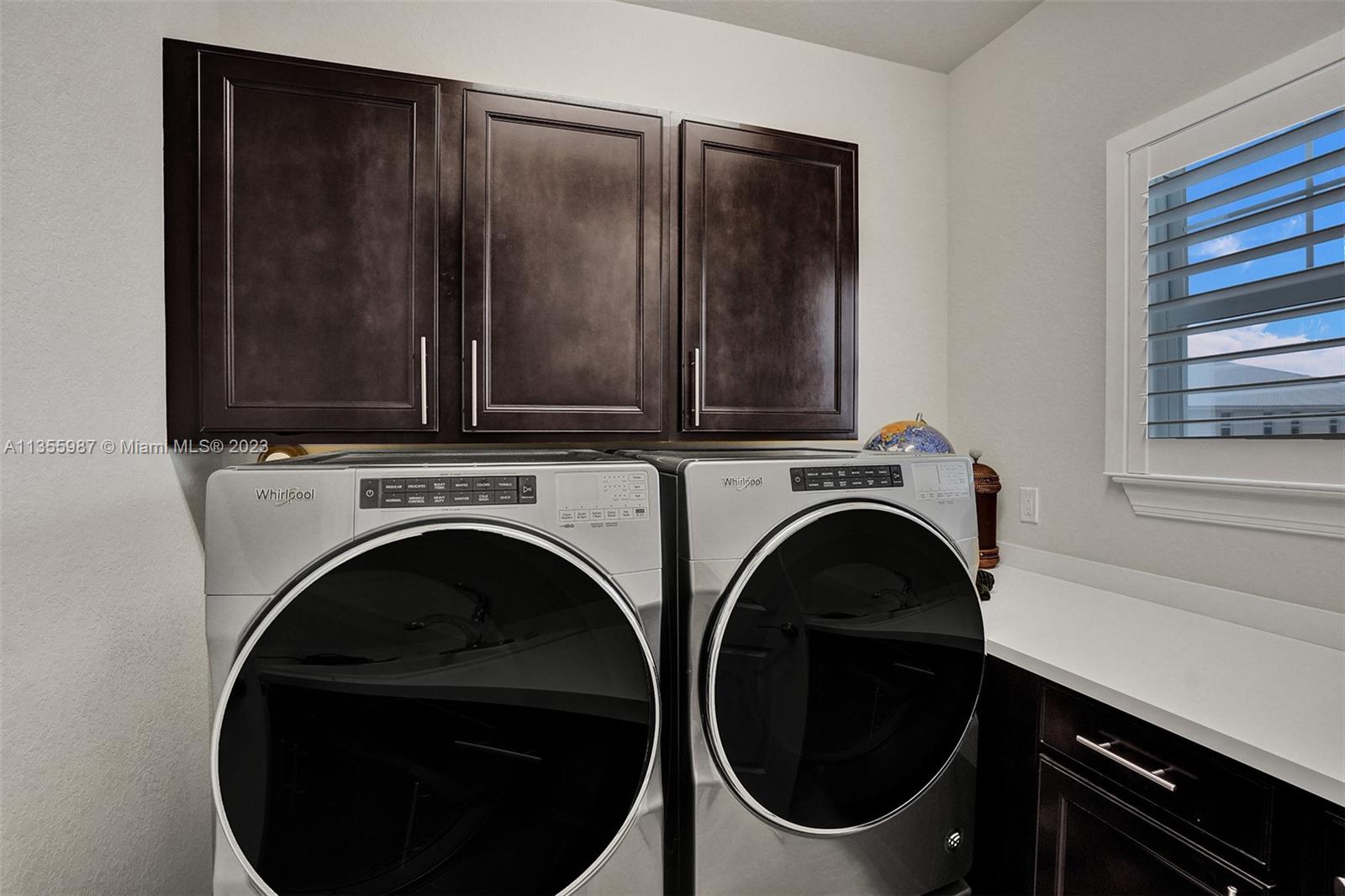 5055 Eucalyptus Drive Hollywood, FL 33021 - Photo 33 of 50 a utility room with dryer and washer