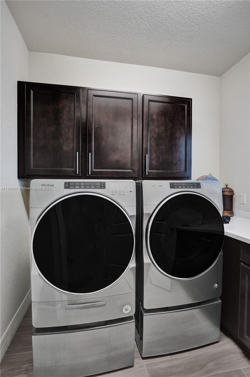 5055 Eucalyptus Drive Hollywood, FL 33021 - Photo 34 of 50 a utility room with dryer and washer