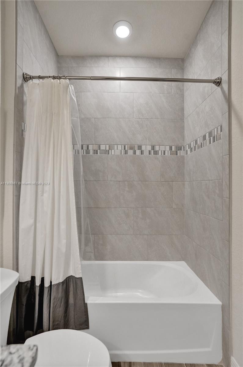 5055 Eucalyptus Drive Hollywood, FL 33021 - Photo 37 of 50 a bathroom with a shower and a toilet