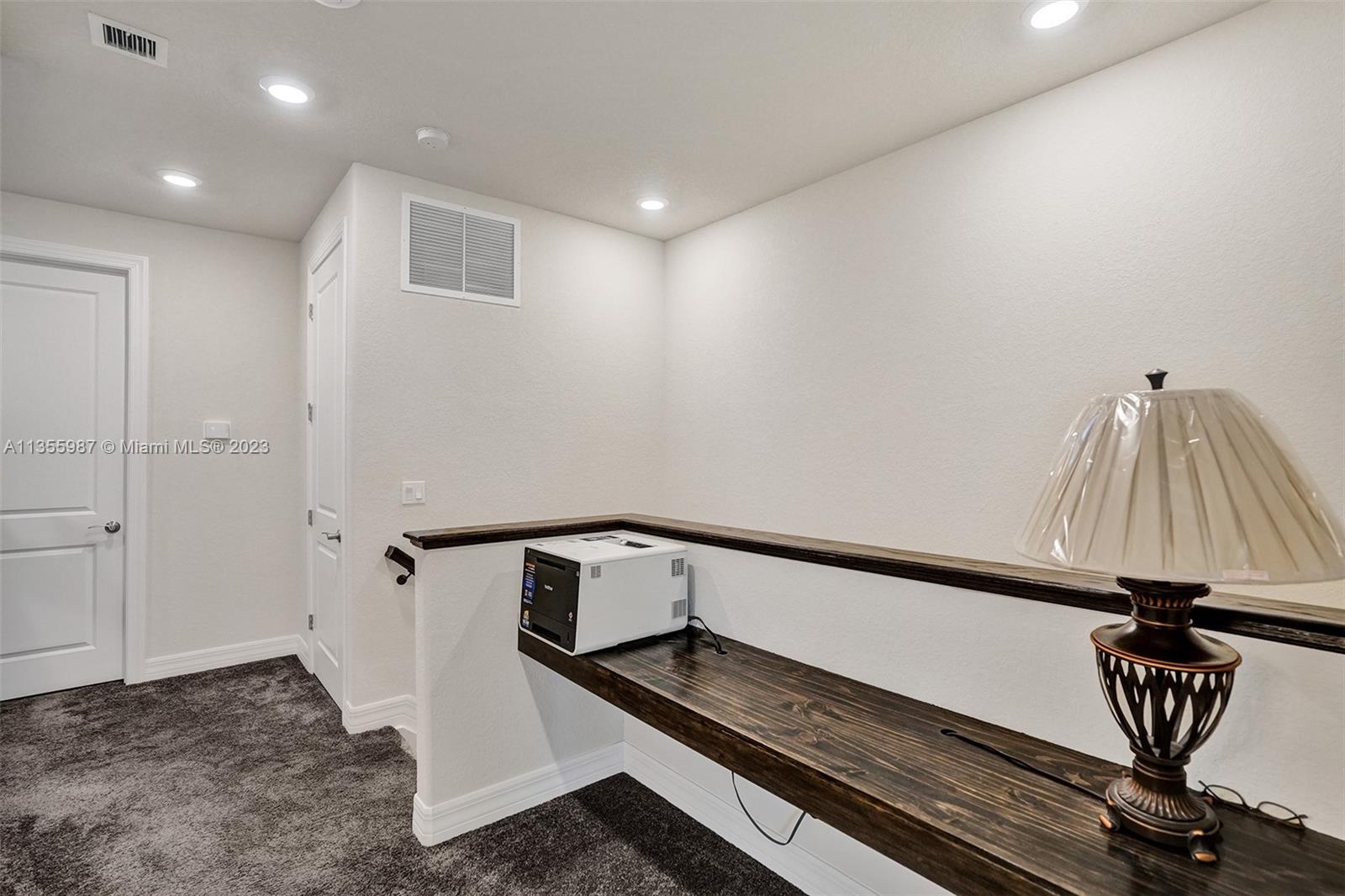 5055 Eucalyptus Drive Hollywood, FL 33021 - Photo 38 of 50 a view of entryway with wooden stairs