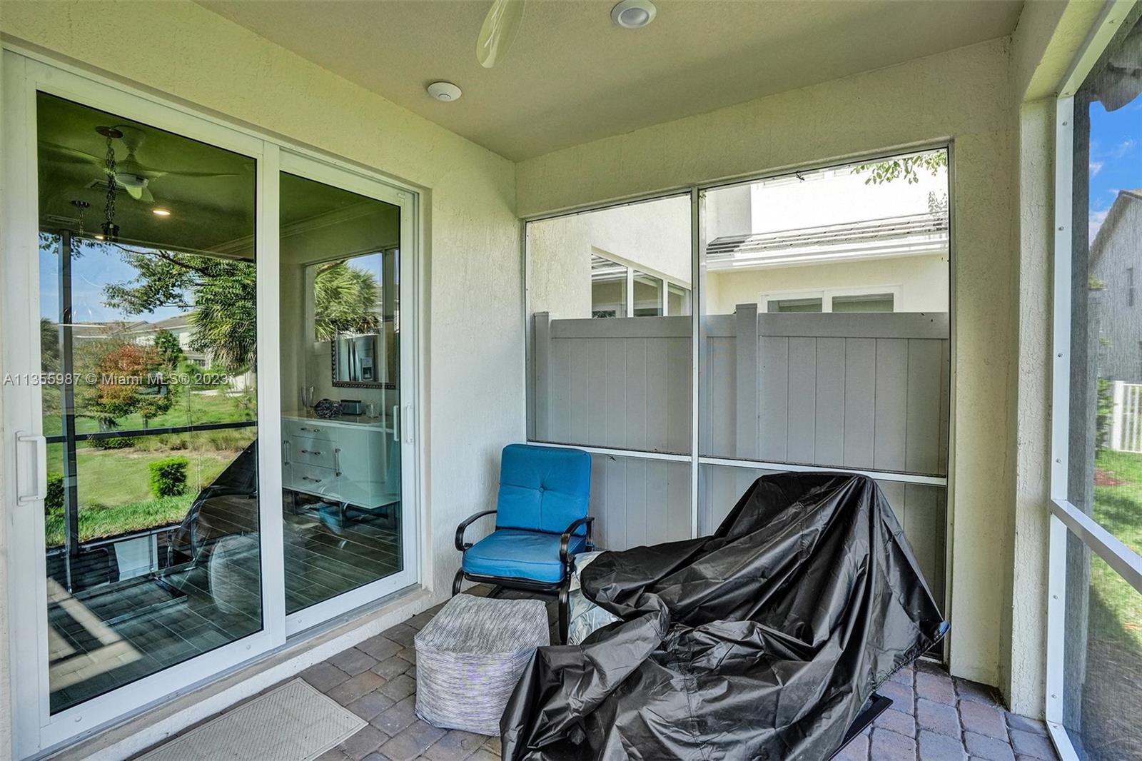 5055 Eucalyptus Drive Hollywood, FL 33021 - Photo 40 of 50 a balcony view with a couch and wooden floor