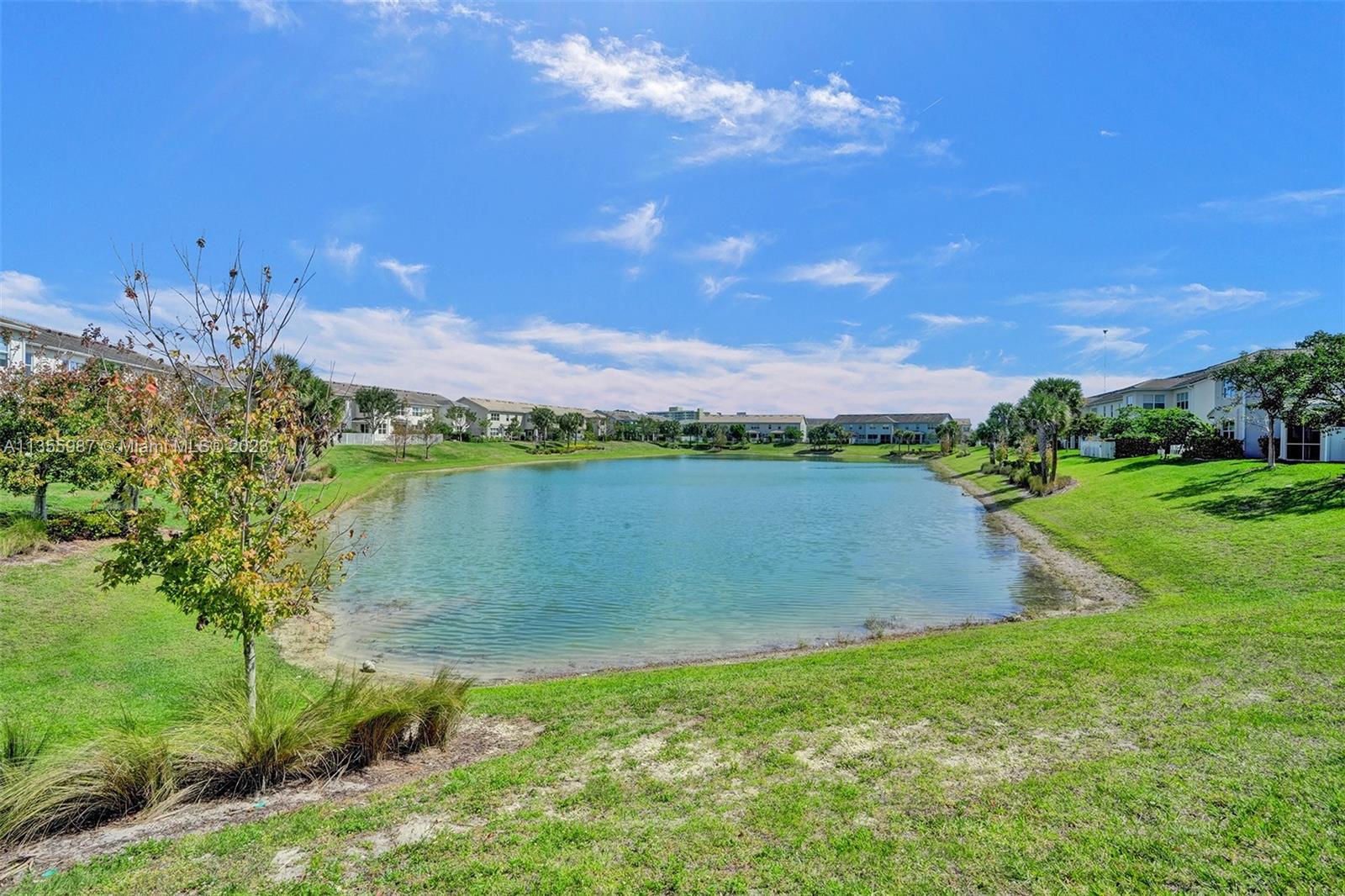 5055 Eucalyptus Drive Hollywood, FL 33021 - Photo 43 of 50 a view of a lake with a house in the background