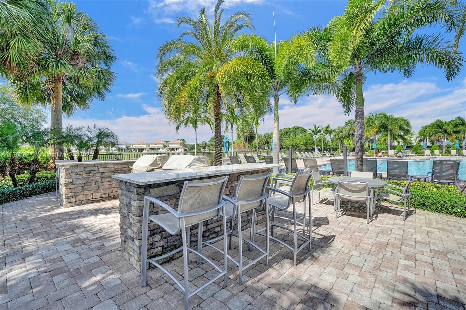 5055 Eucalyptus Drive Hollywood, FL 33021 - Photo 45 of 50 a view of an outdoor space with dining table and chairs