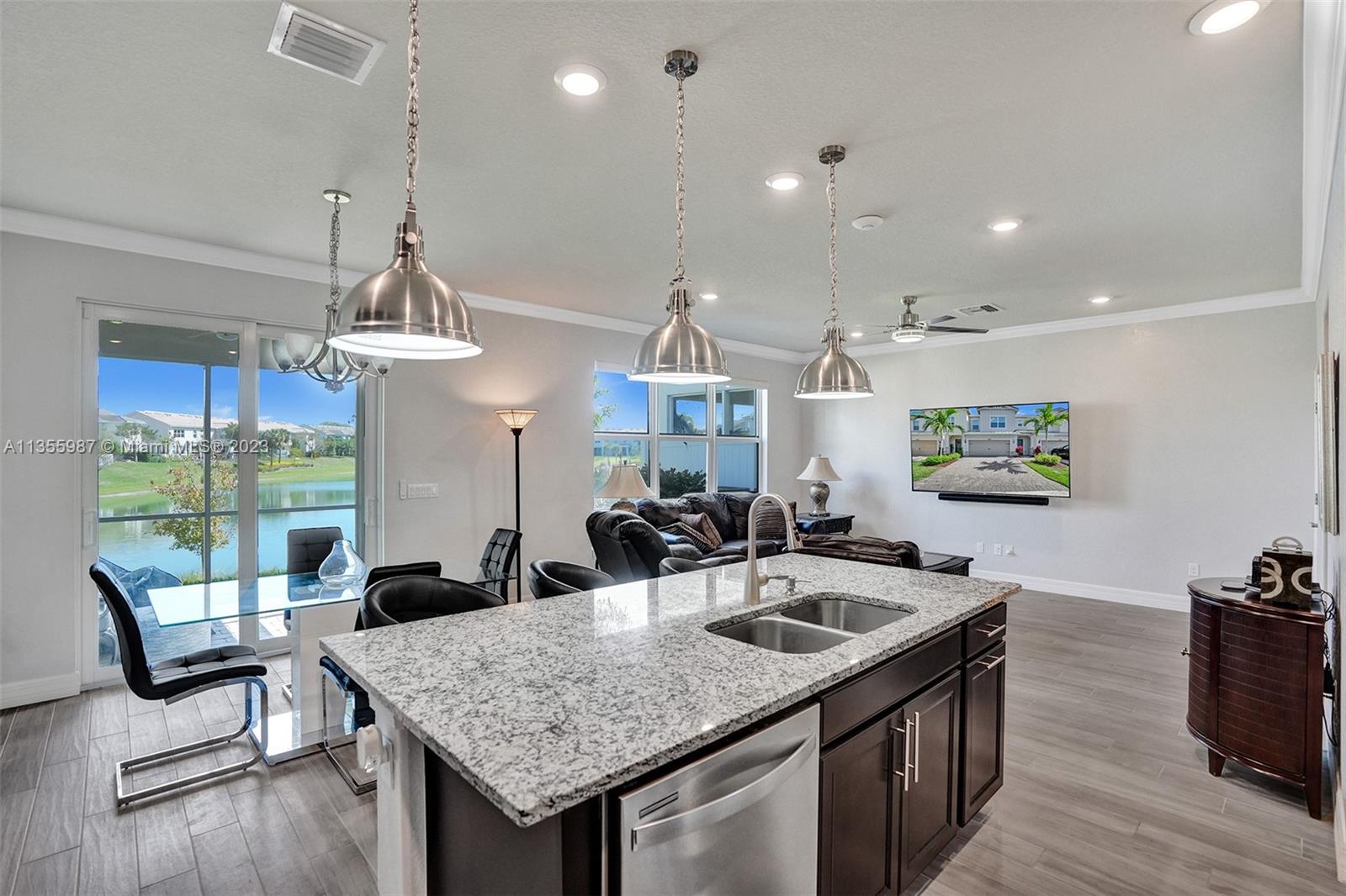 5055 Eucalyptus Drive Hollywood, FL 33021 - Photo 8 of 50 a kitchen with sink and refrigerator
