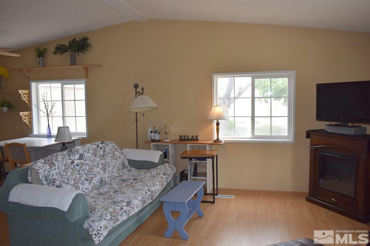 260 Zircon Drive Reno, NV 89521 - Photo 3 of 17 a bedroom with a bed and a flat screen tv