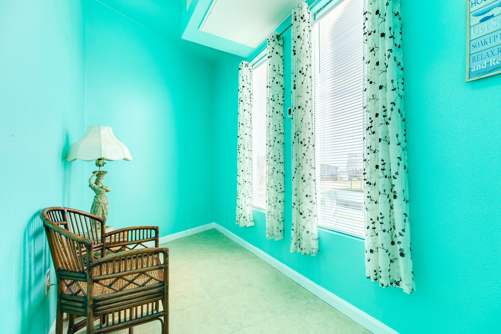 131 Point Lafitte Court Surfside Beach, TX 77541 - Photo 18 of 28 a room with window and a chandelier