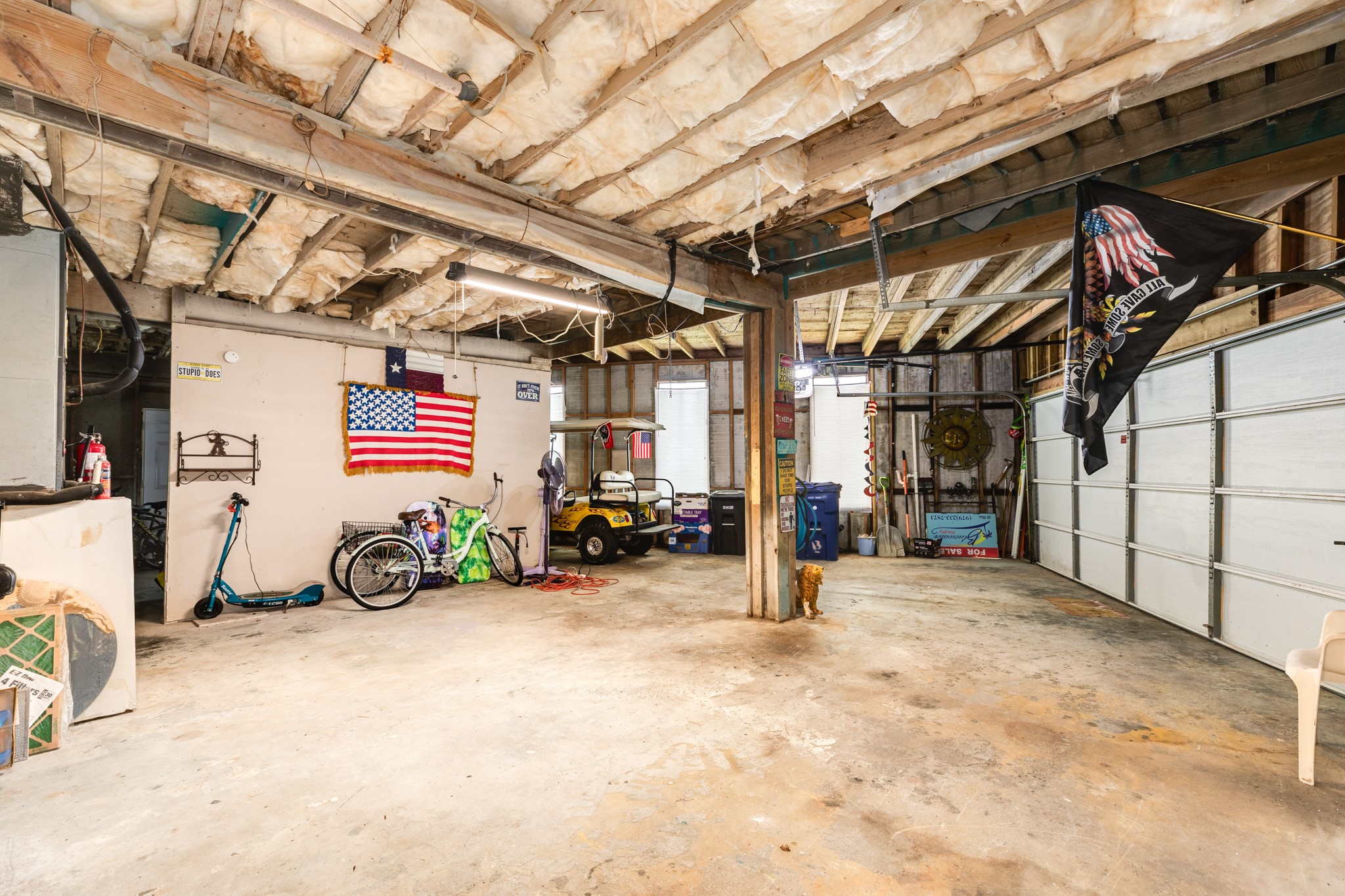 131 Point Lafitte Court Surfside Beach, TX 77541 - Photo 28 of 28 a view of a garage with a bike and a roof