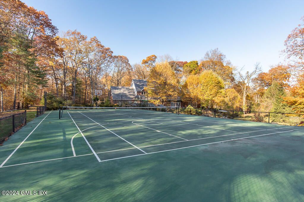 158 Clapboard Ridge Road Greenwich, CT 06831 - Photo 5 of 41 a view of a tennis ground with large trees