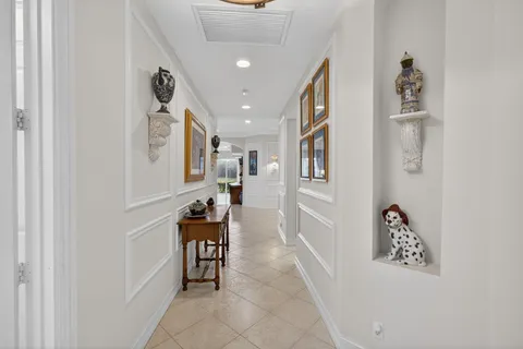 a view of a dining room with furniture and a chandelier