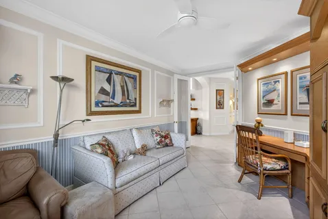 a kitchen with white cabinets appliances and a sink