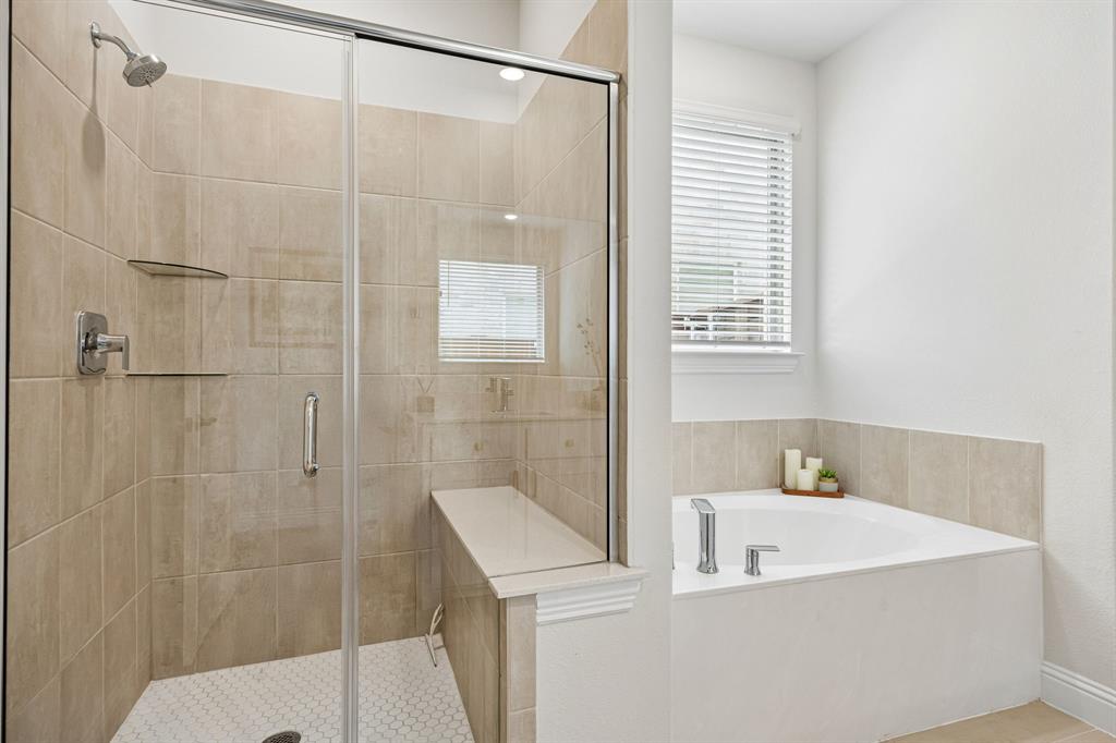 425 Breeds Hl Road Little Elm, TX 75068 - Photo 15 of 38 a bathroom with a bathtub and shower