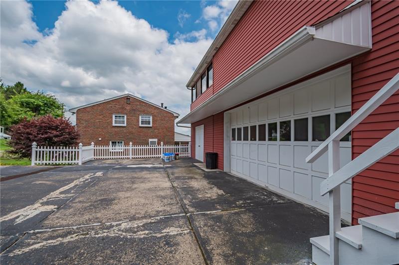1508 Bakerstown Road Tarentum, PA 15084 - Photo 25 of 25 Driveway is being resealed! Spacious two car garage with storage beside it.