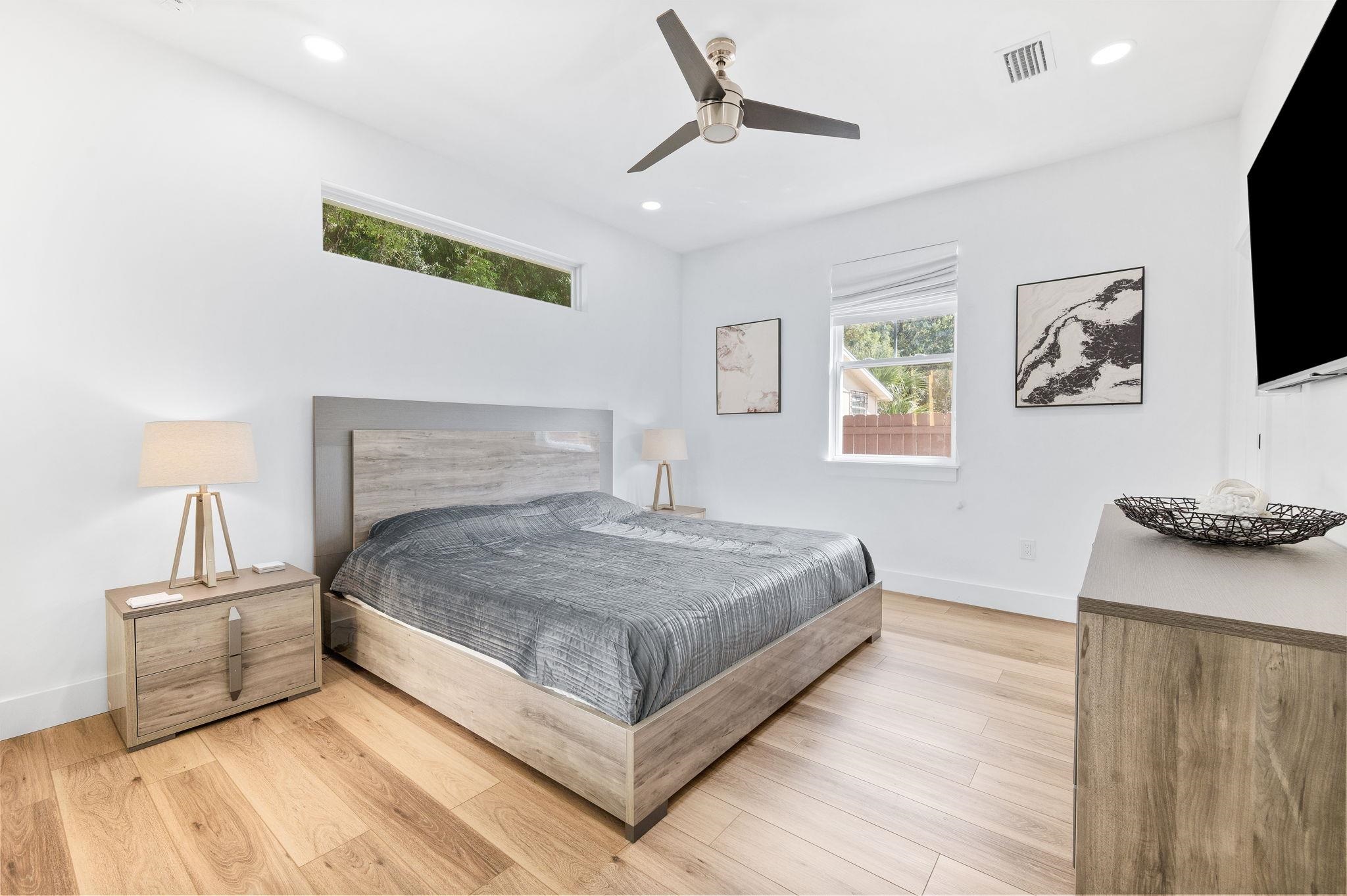 135 Blanco Street St. Augustine, FL 32084 - Photo 15 of 35 a bedroom with a bed and a flat screen tv