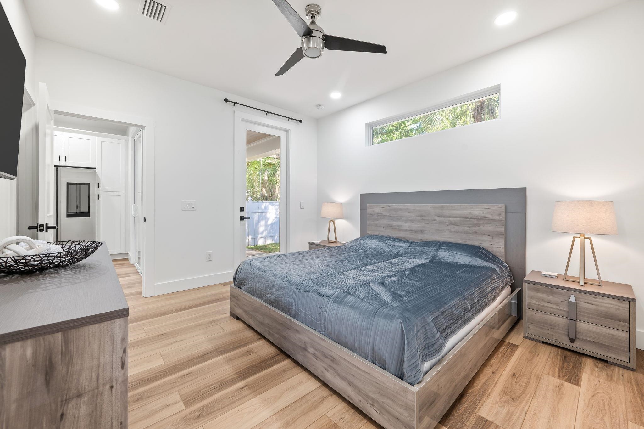 135 Blanco Street St. Augustine, FL 32084 - Photo 16 of 35 a spacious bedroom with a bed and wooden floor