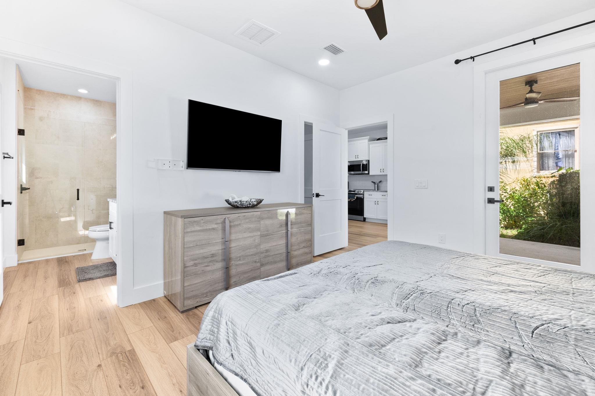 135 Blanco Street St. Augustine, FL 32084 - Photo 19 of 35 a bedroom with a bed and a flat screen tv