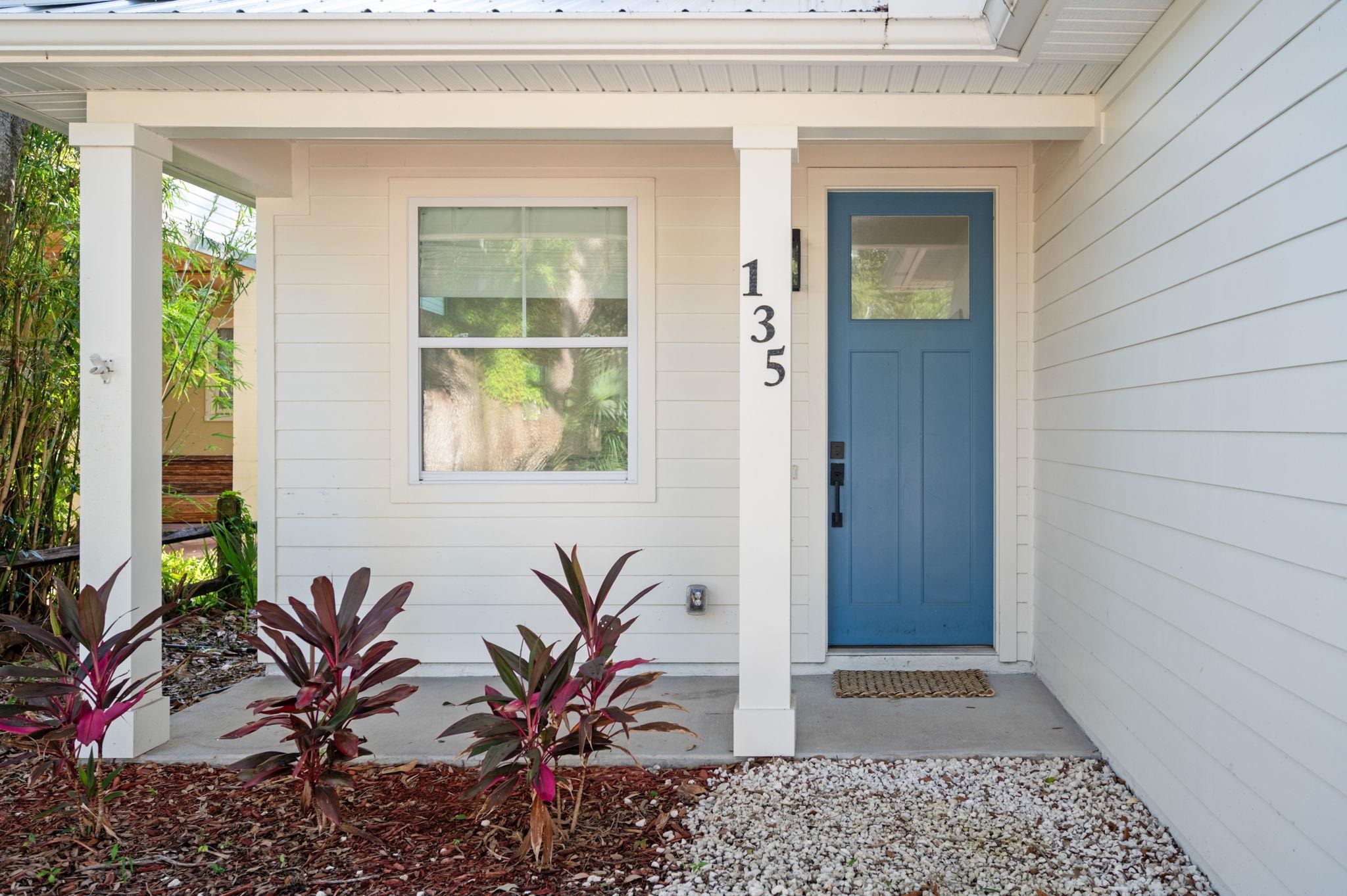 135 Blanco Street St. Augustine, FL 32084 - Photo 2 of 35 a potted plant in front of a door