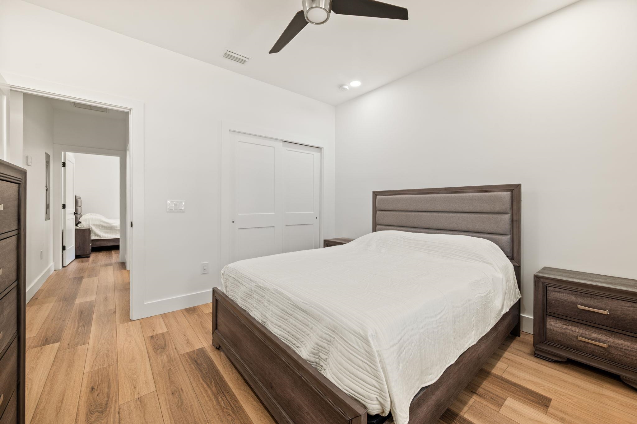 135 Blanco Street St. Augustine, FL 32084 - Photo 25 of 35 a bedroom with a bed and wooden floor