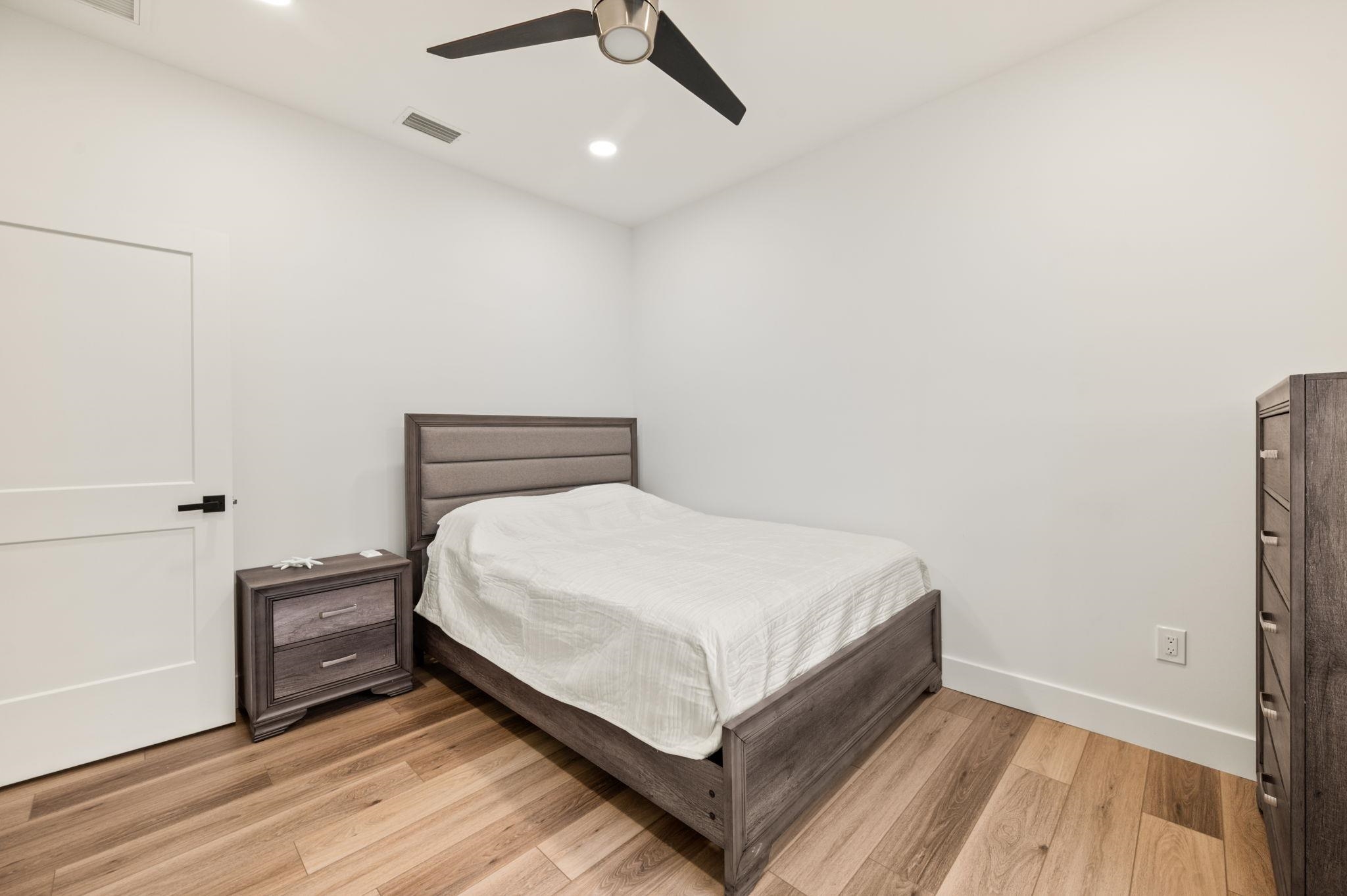 135 Blanco Street St. Augustine, FL 32084 - Photo 28 of 35 a large bed sitting in a bedroom next to a window