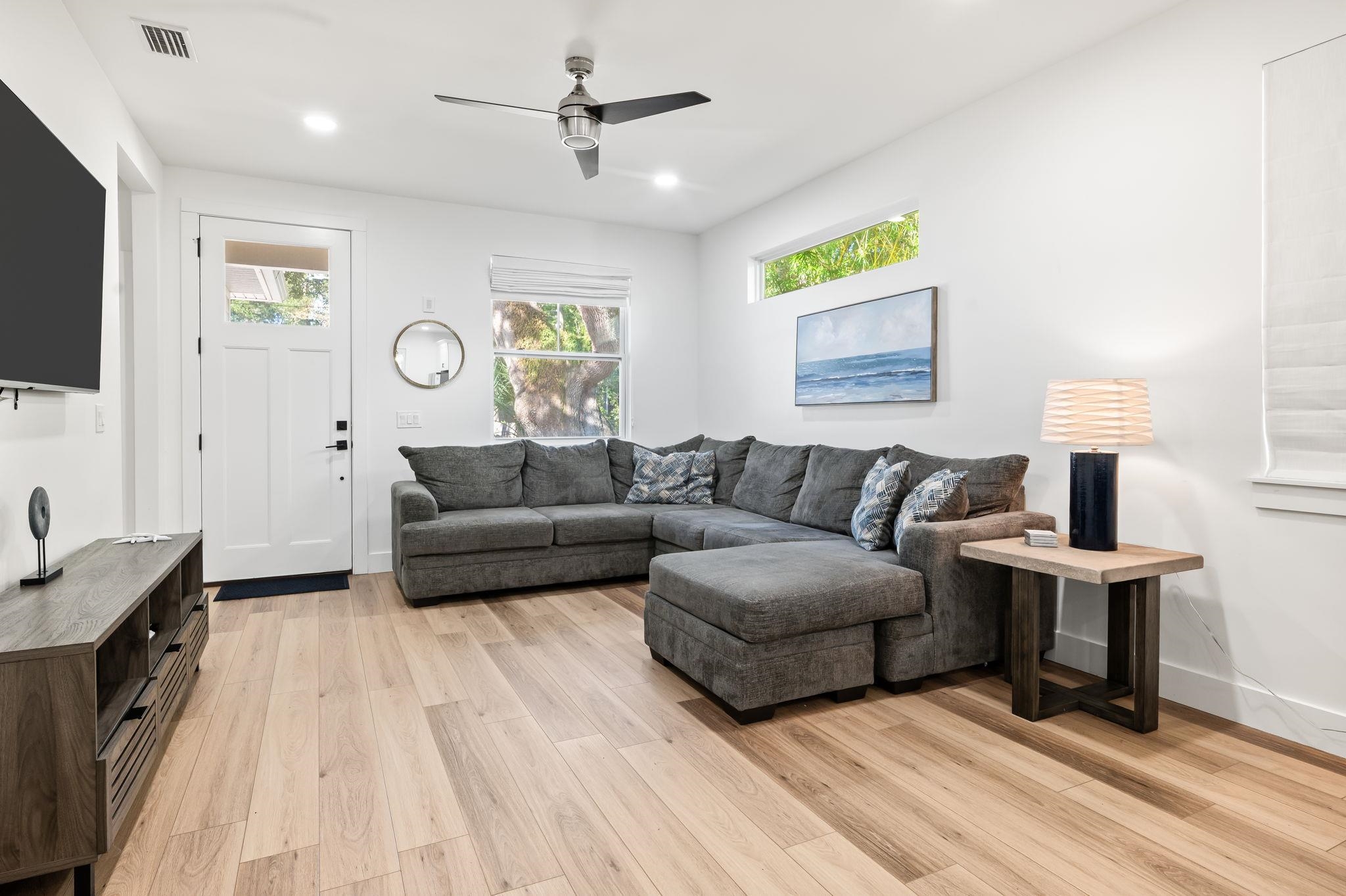 135 Blanco Street St. Augustine, FL 32084 - Photo 4 of 35 a living room with furniture a flat screen tv and a lamp