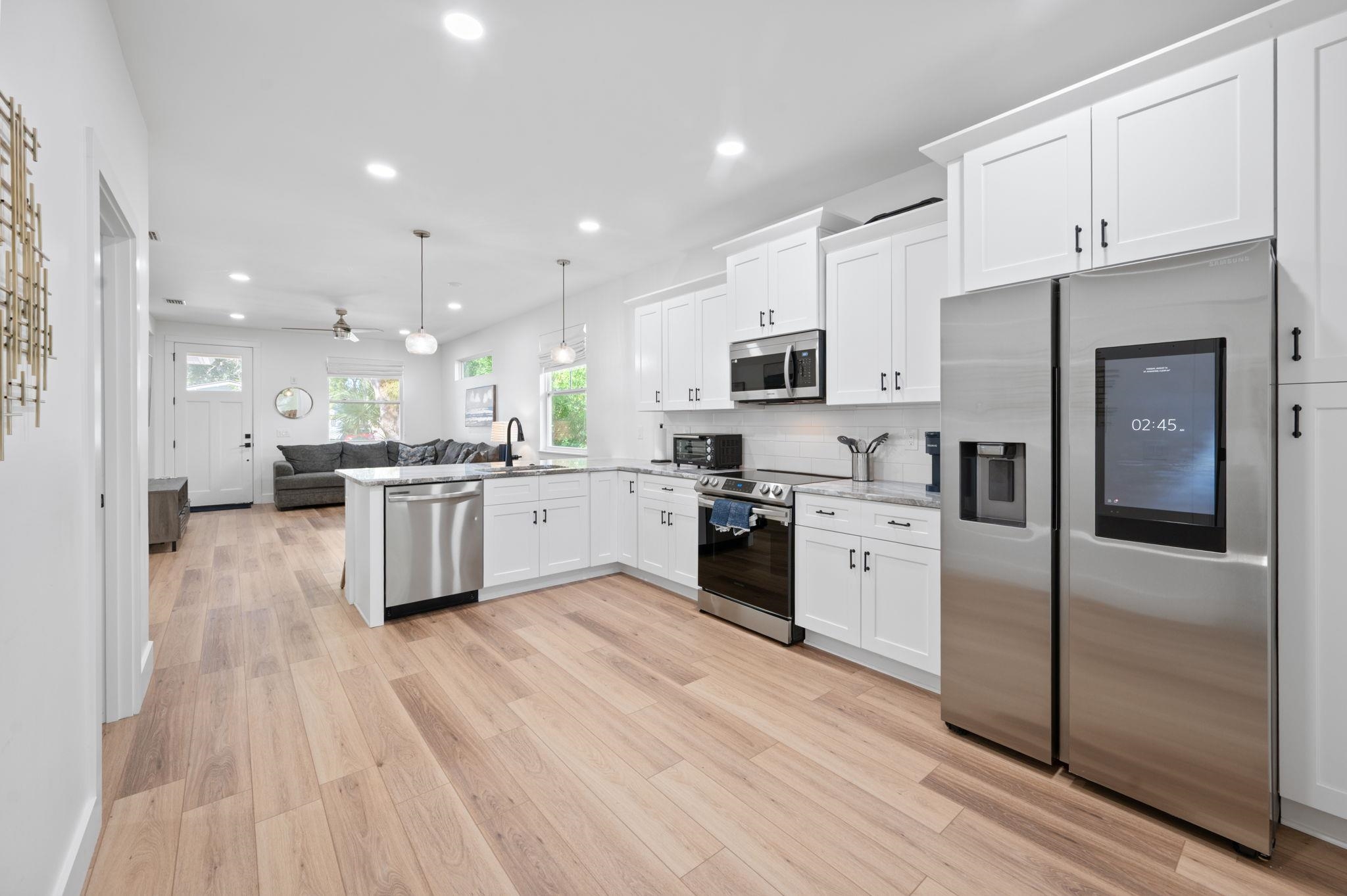 135 Blanco Street St. Augustine, FL 32084 - Photo 7 of 35 a kitchen with a refrigerator a sink and cabinets