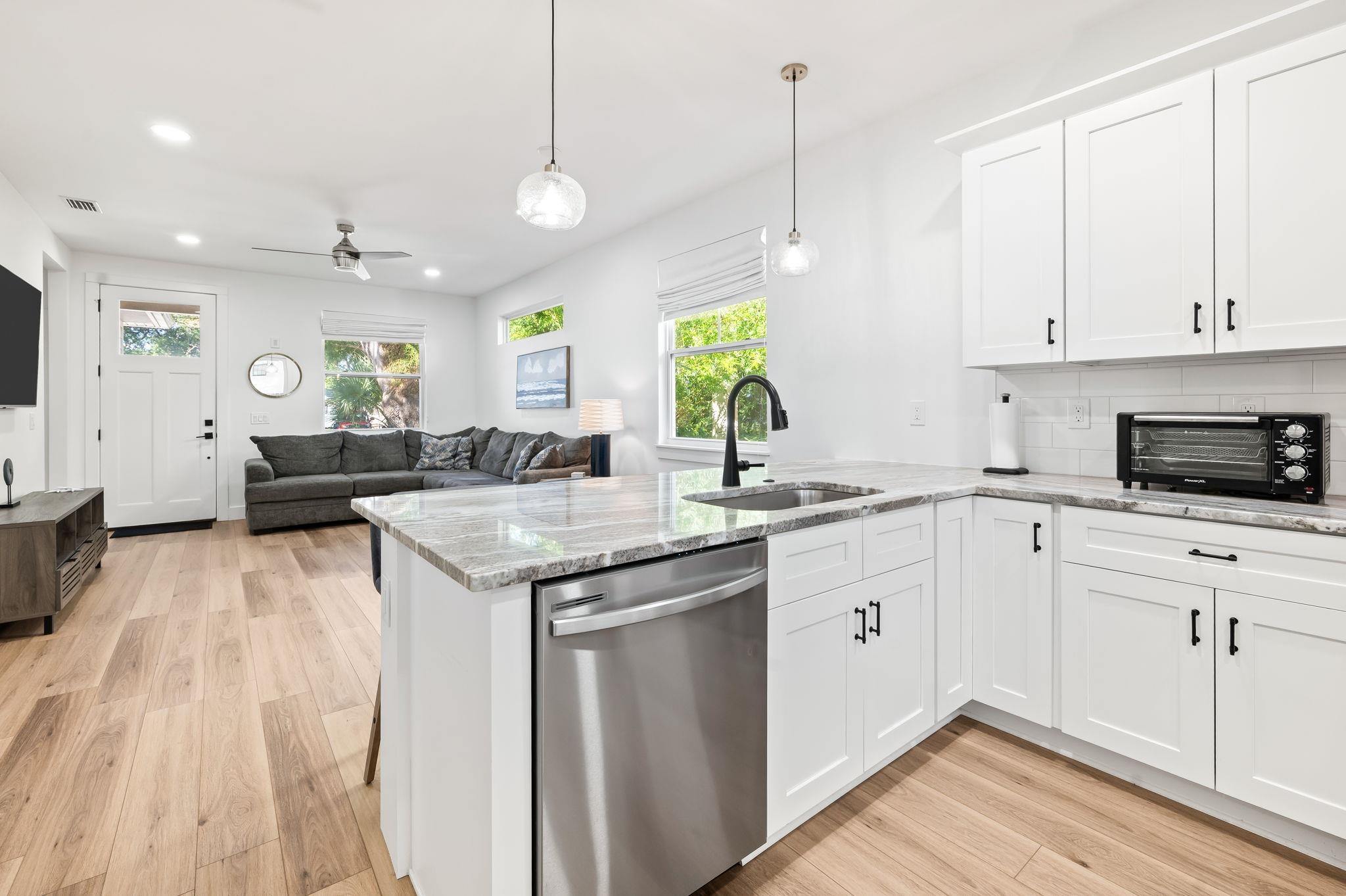 135 Blanco Street St. Augustine, FL 32084 - Photo 9 of 35 a kitchen with a sink stove and cabinets