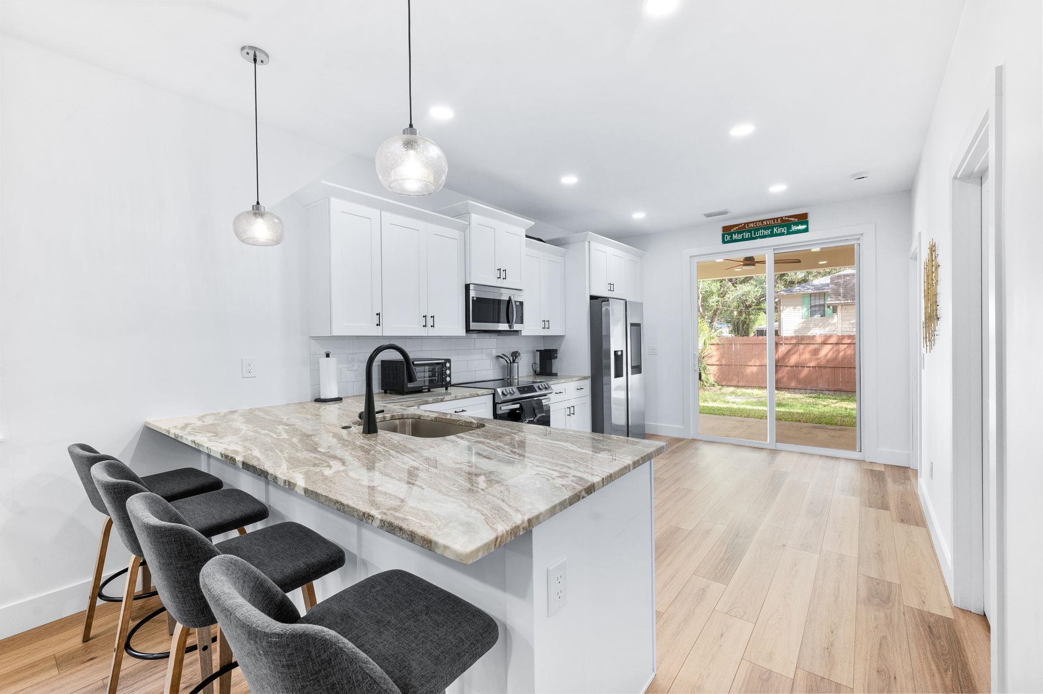 135 Blanco Street St. Augustine, FL 32084 - Photo 10 of 35 a view of kitchen and dining area with furniture