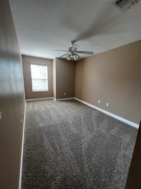 25 3rd Street Shalimar, FL 32579 - Photo 11 of 14 an empty room with windows and fan