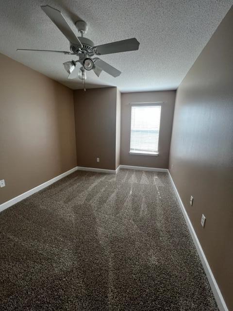 25 3rd Street Shalimar, FL 32579 - Photo 12 of 14 an empty room with a ceiling fan and window