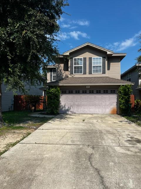 25 3rd Street Shalimar, FL 32579 - Photo 2 of 14 a front view of a house with a yard