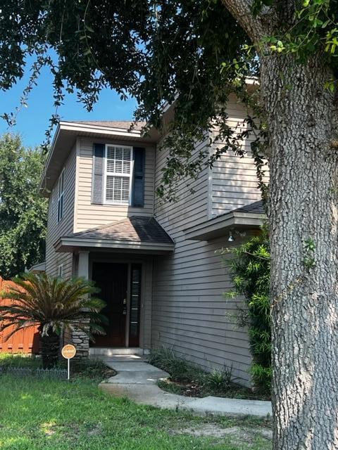 25 3rd Street Shalimar, FL 32579 - Photo 4 of 14 a view of a house with a yard and plants