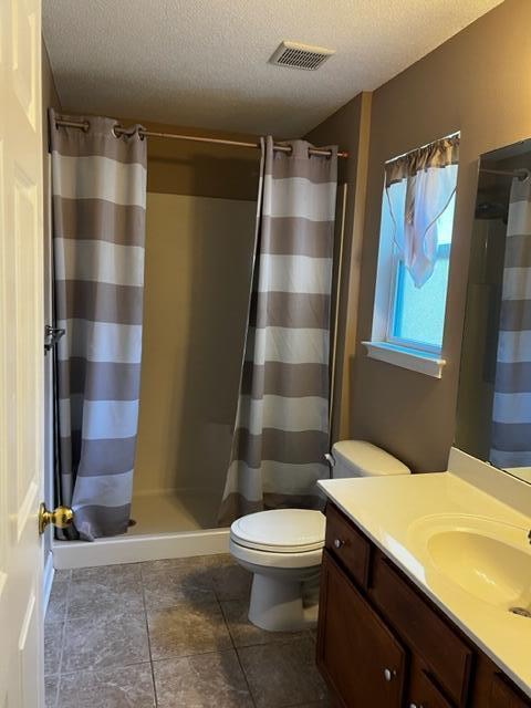 25 3rd Street Shalimar, FL 32579 - Photo 5 of 14 a bathroom with a sink a toilet a shower and a mirror