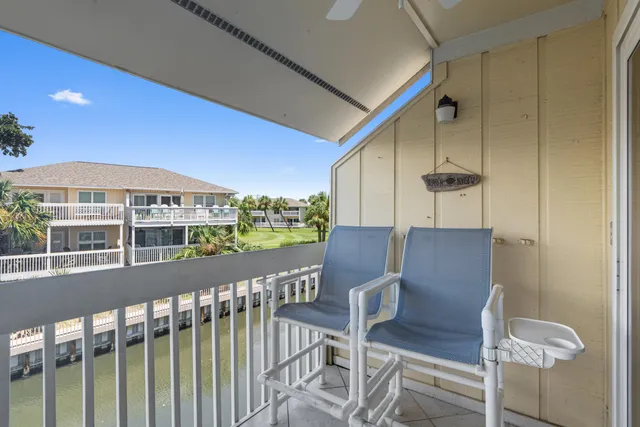a view of a balcony with furniture