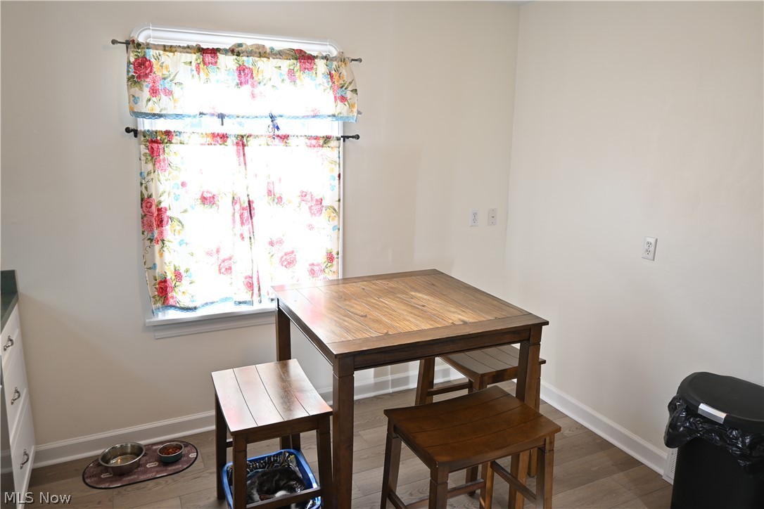 94 North 5th Street Rittman, OH 44270 - Photo 5 of 27 Dining space with wood finished floors and baseboards