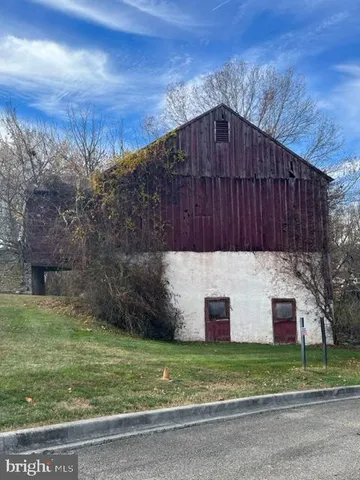 a view of a field with an trees