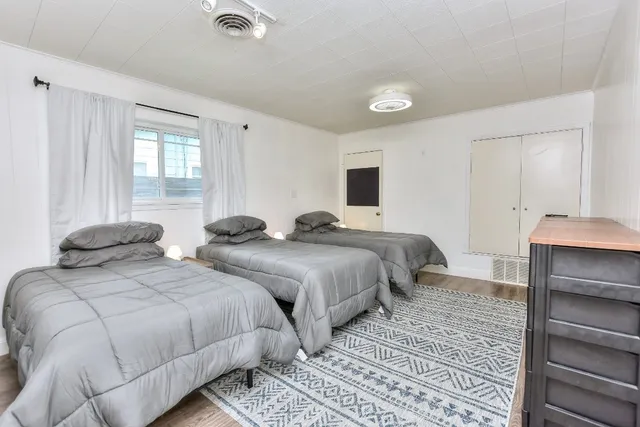 a view of a livingroom with furniture and wooden floor