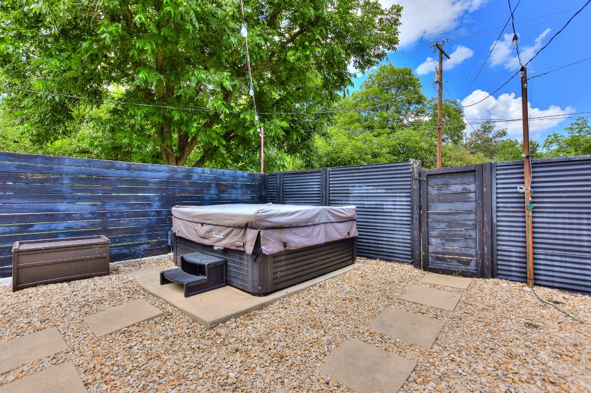 1407 East 19th Street Georgetown, TX 78626 - Photo 32 of 36 a view of a backyard with a wooden fence