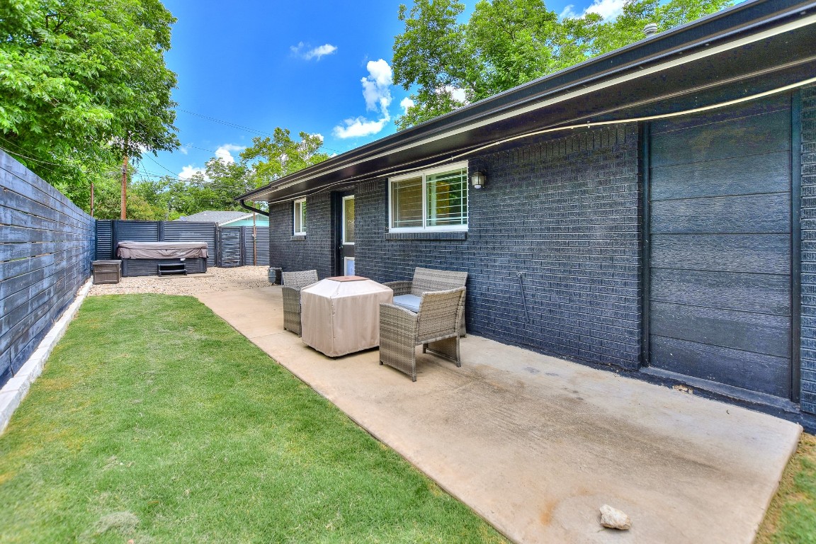 1407 East 19th Street Georgetown, TX 78626 - Photo 35 of 36 a view of a backyard with table and chairs and a barbeque