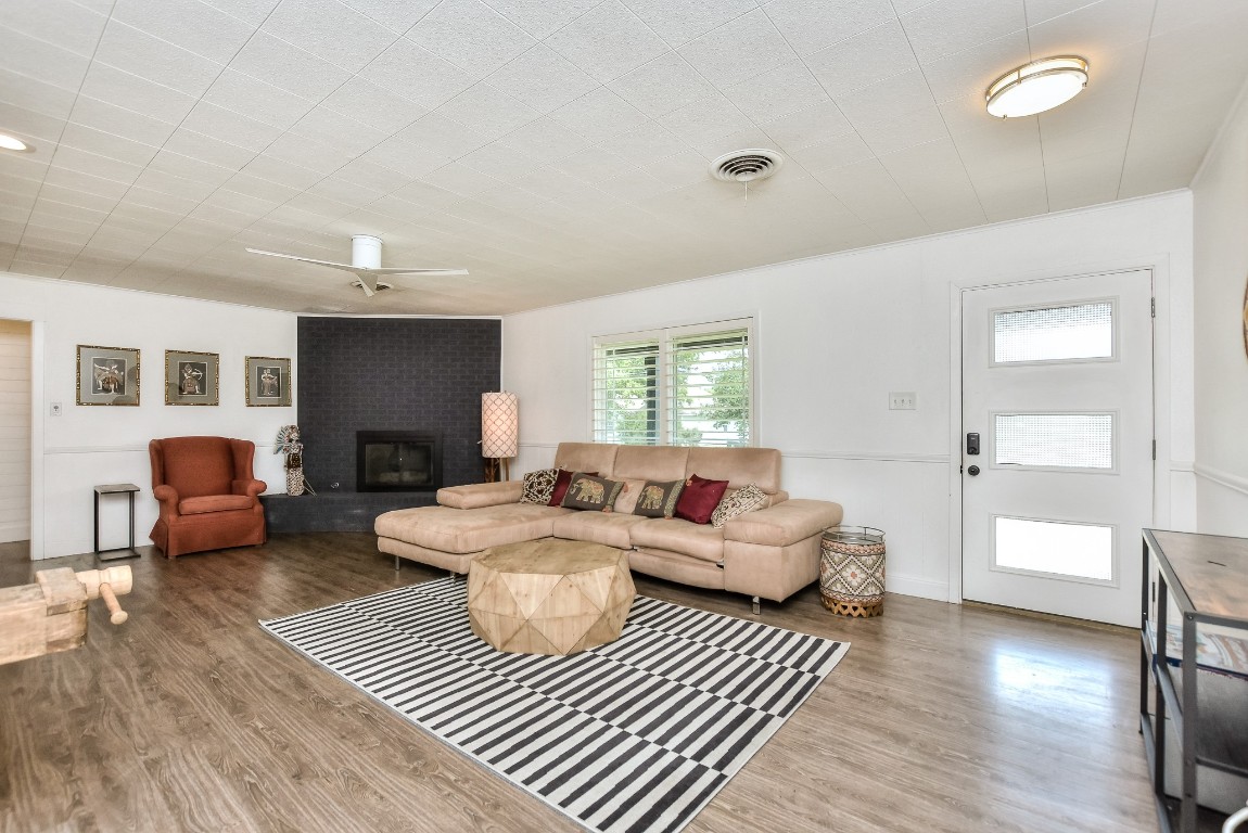 1407 East 19th Street Georgetown, TX 78626 - Photo 6 of 36 a living room with furniture a fireplace and a table