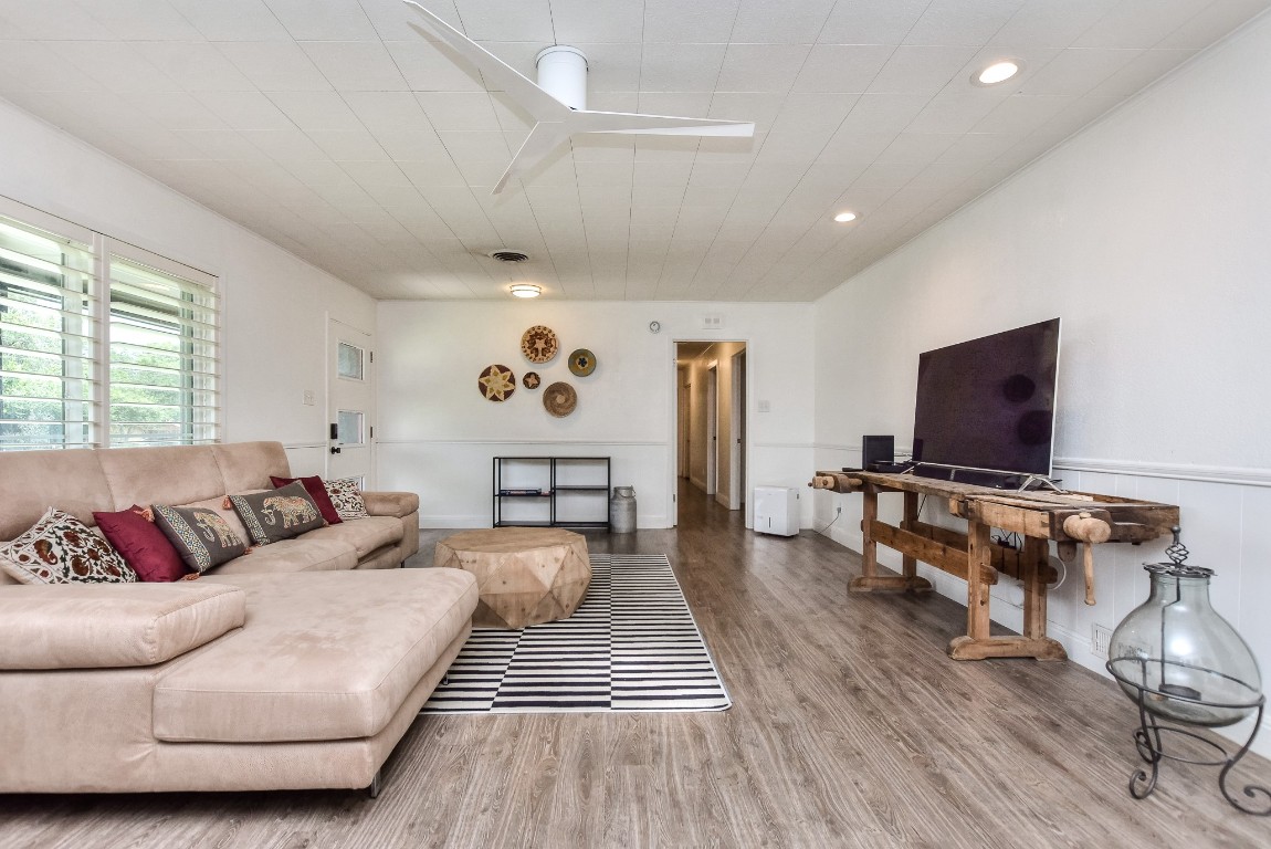 1407 East 19th Street Georgetown, TX 78626 - Photo 7 of 36 a living room with furniture and a flat screen tv