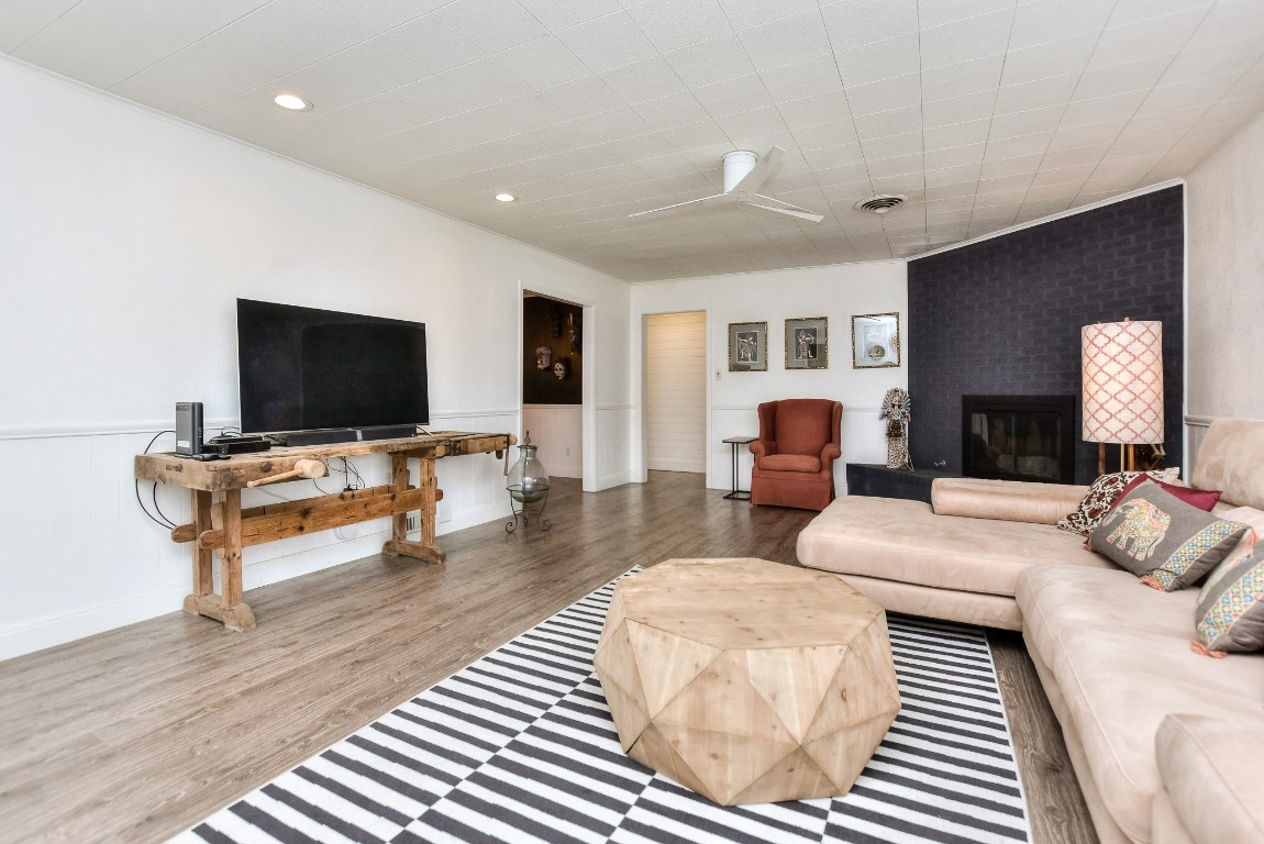 1407 East 19th Street Georgetown, TX 78626 - Photo 8 of 36 a living room with furniture and a flat screen tv