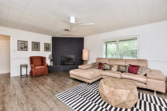 a living room with furniture and a window