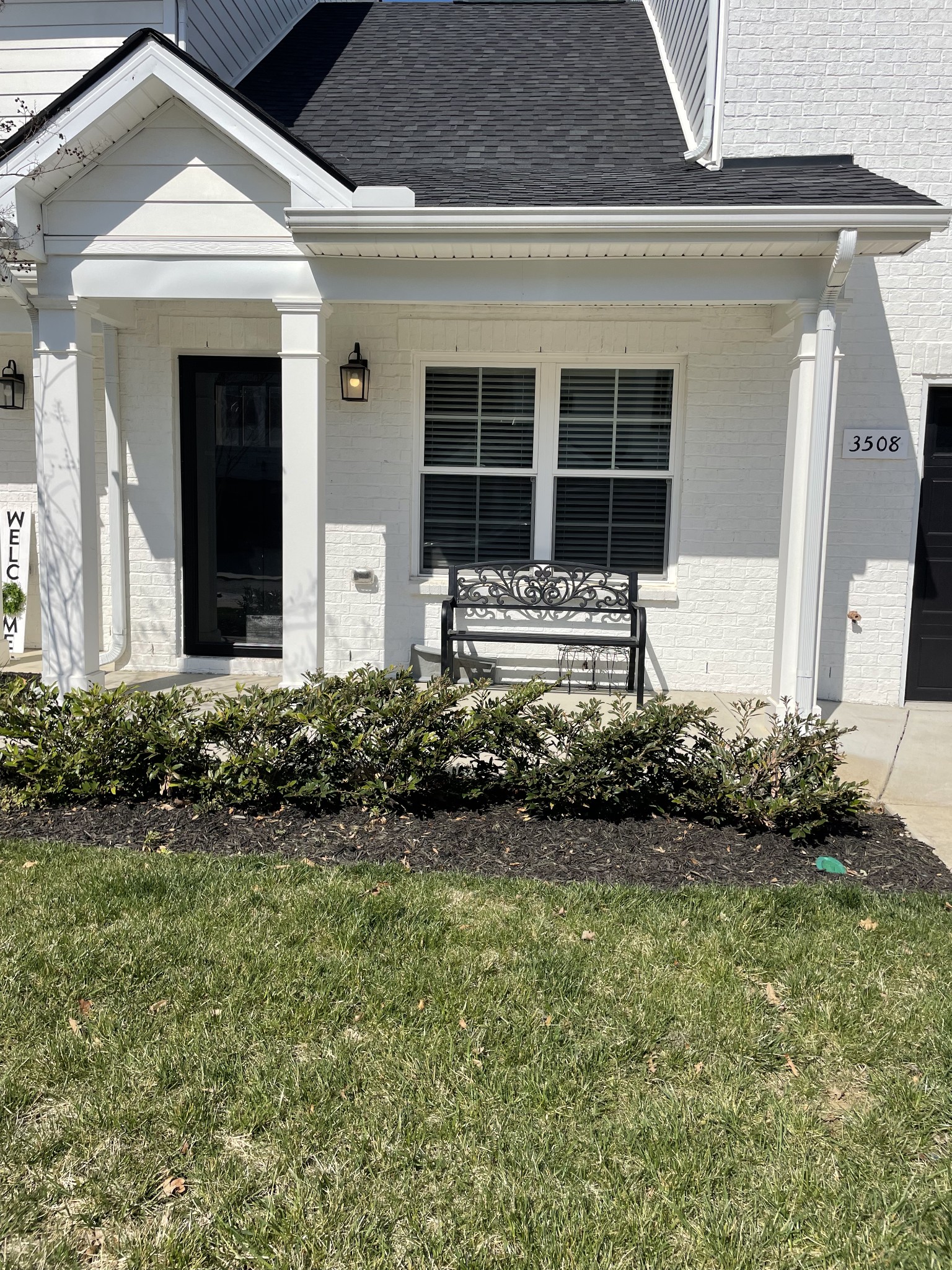 a front view of a house with garden