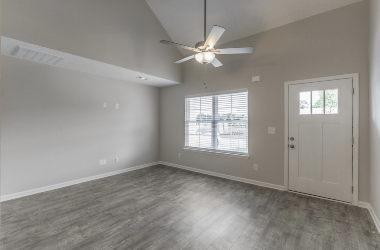 3508 Learning Lane Murfreesboro, TN 37128 - Photo 2 of 4 an empty room with wooden floor fan and windows