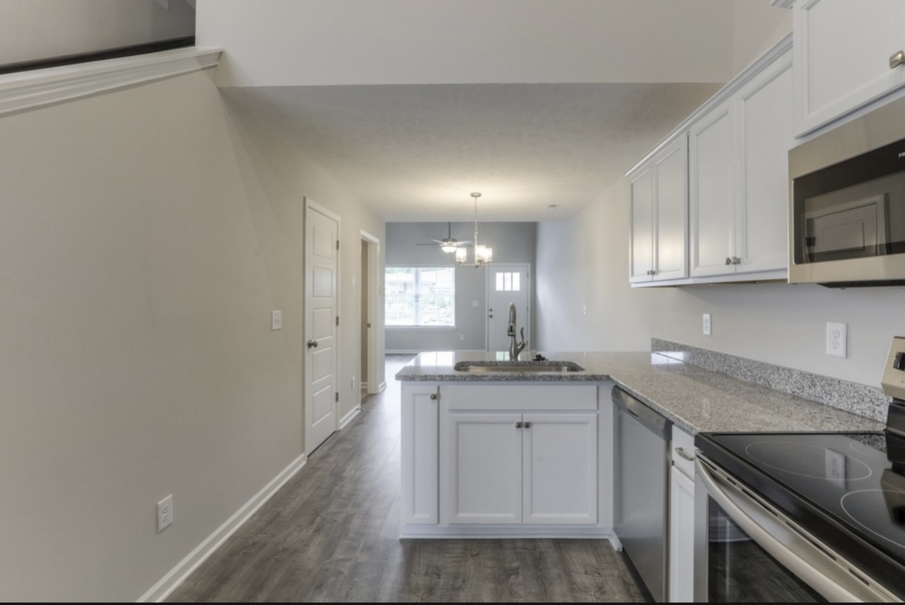 3508 Learning Lane Murfreesboro, TN 37128 - Photo 3 of 4 a kitchen with a sink stove and cabinets