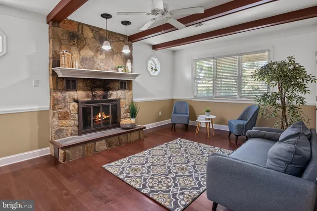 a bedroom with bed and wooden floor