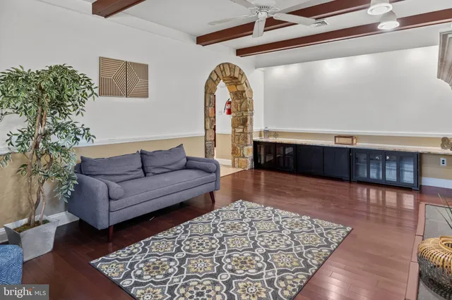 a spacious bedroom with a bed and a table in it