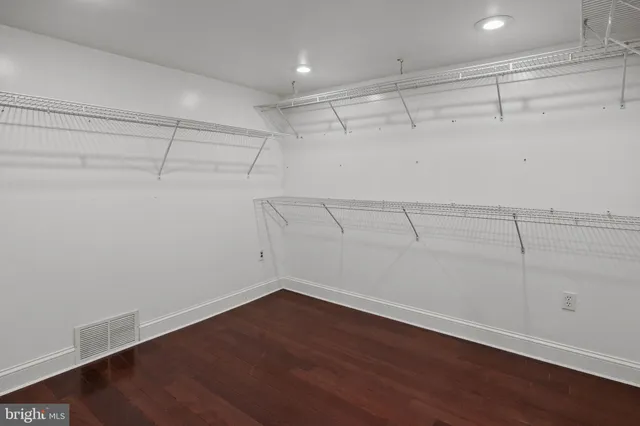 a bedroom with bed and a window