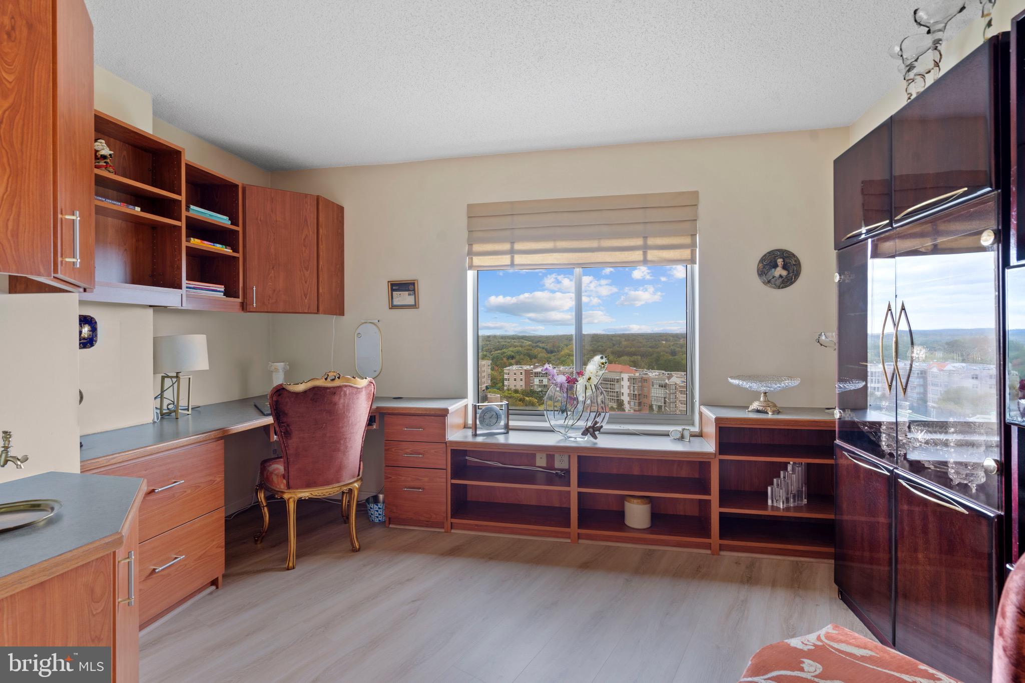 19385 Cypress Ridge Terrace, Unit 914 Leesburg, VA 20176 - Photo 12 of 39 a room with furniture a large window and furniture