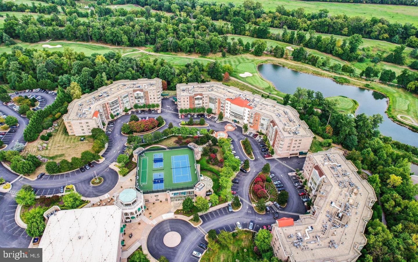 19385 Cypress Ridge Terrace, Unit 914 Leesburg, VA 20176 - Photo 25 of 39 an aerial view of a house with a garden and lake view