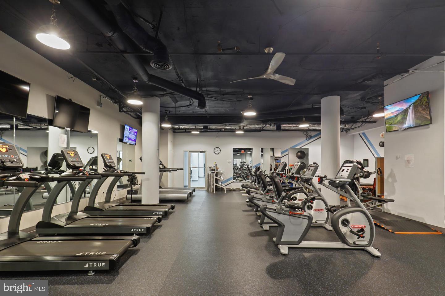 19385 Cypress Ridge Terrace, Unit 914 Leesburg, VA 20176 - Photo 35 of 39 a view of a room with gym equipment